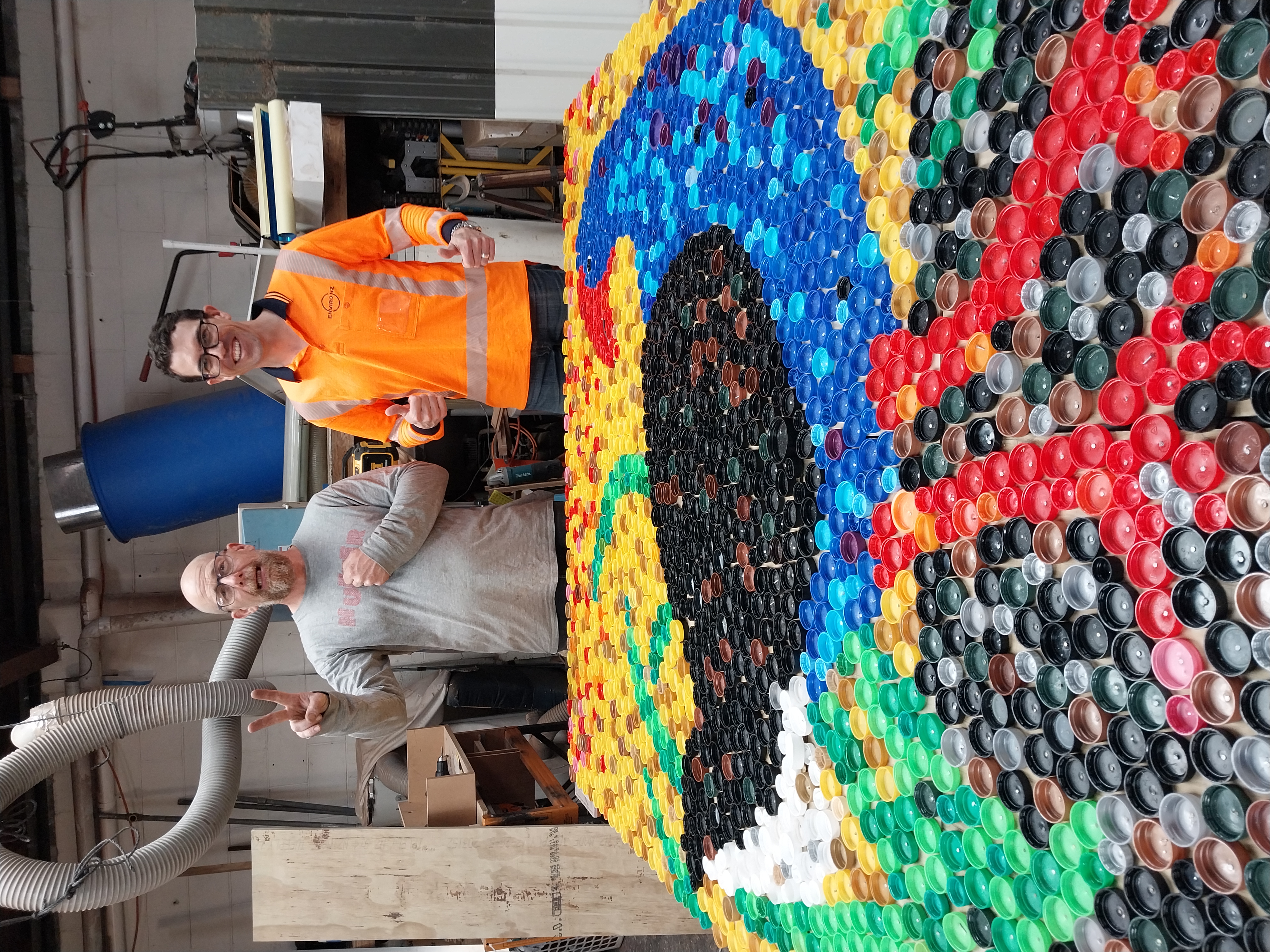 Plastic lid Pūkeko mural created by everyday environmentalist, Rowan